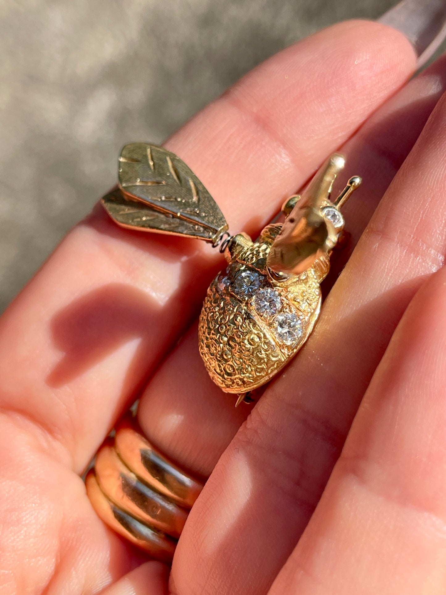 Vintage yellow 18K and approx .6 ctw diamond bee pin with tremblant wings, approx 1 and 5/8 inch