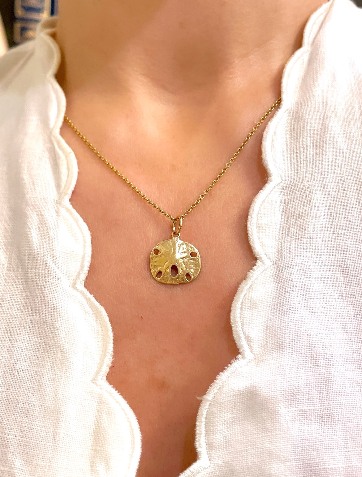 Vintage yellow 14K sanddollar charm