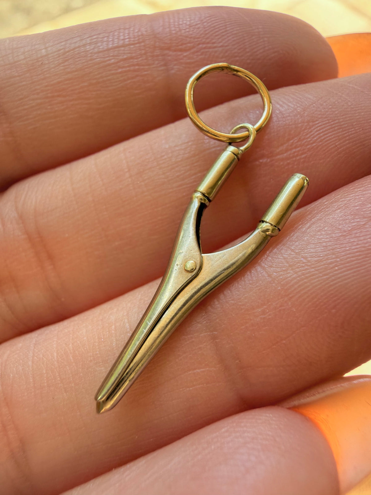 Vintage 14K articulated curling iron charm