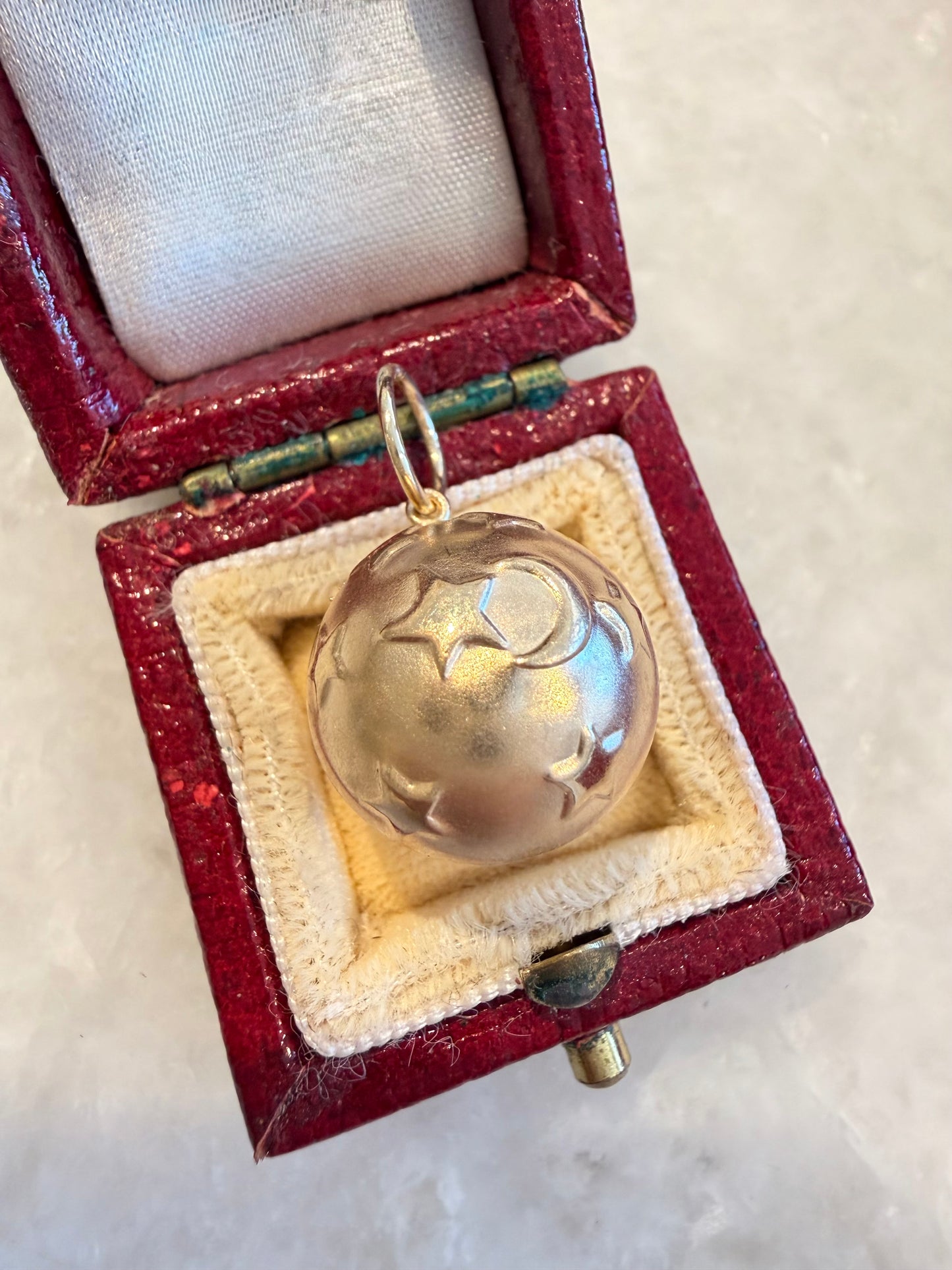 Vintage yellow 14K gold puffy ball with stars and moons charm