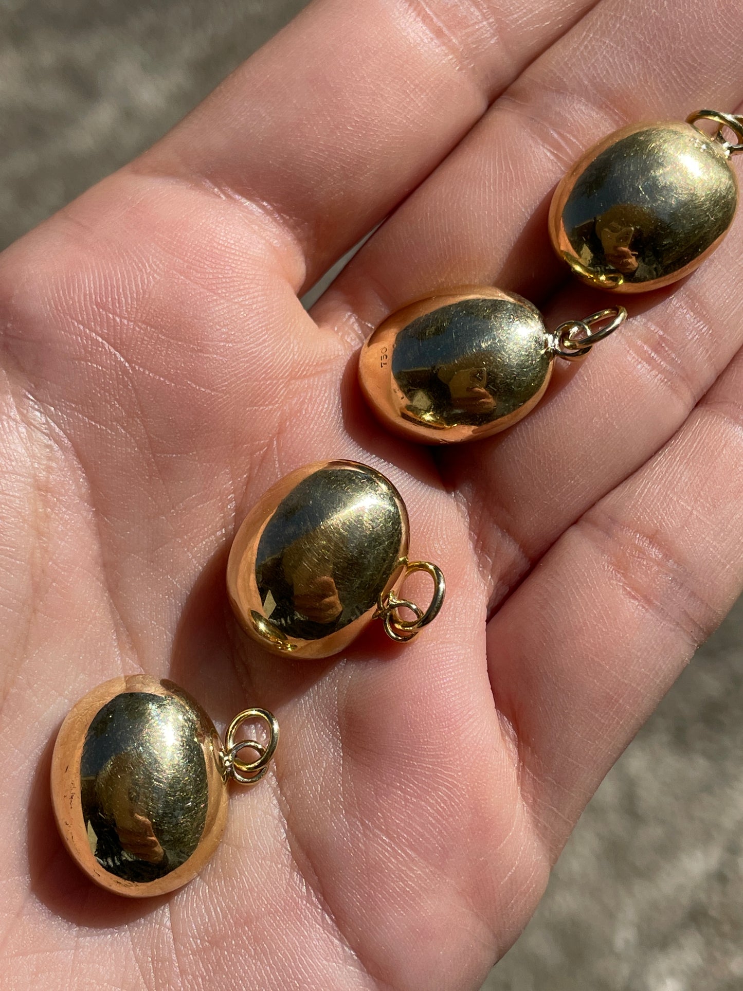 Vintage yellow 18K carved carnelian aquatic animal pebble pendants