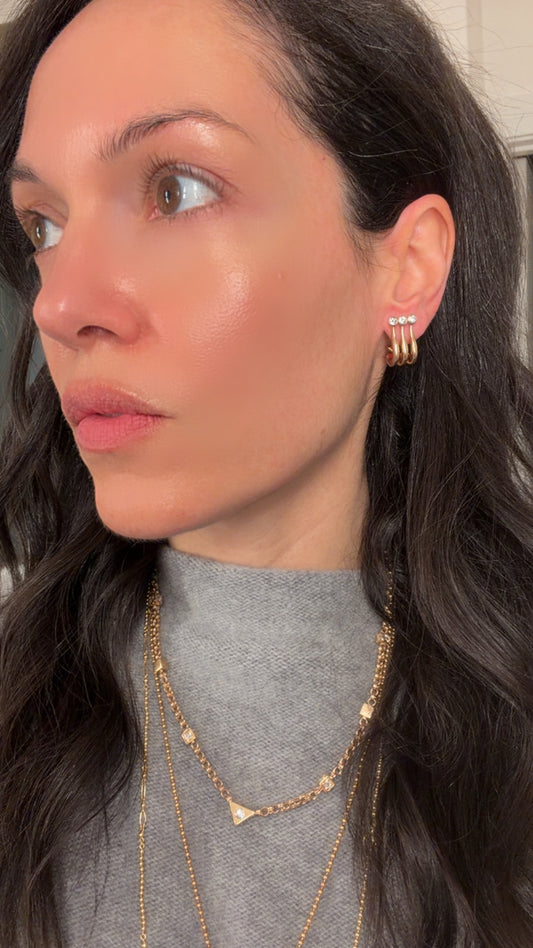 Vintage 14K and approx .84ctw bezel set diamond omega back earrings