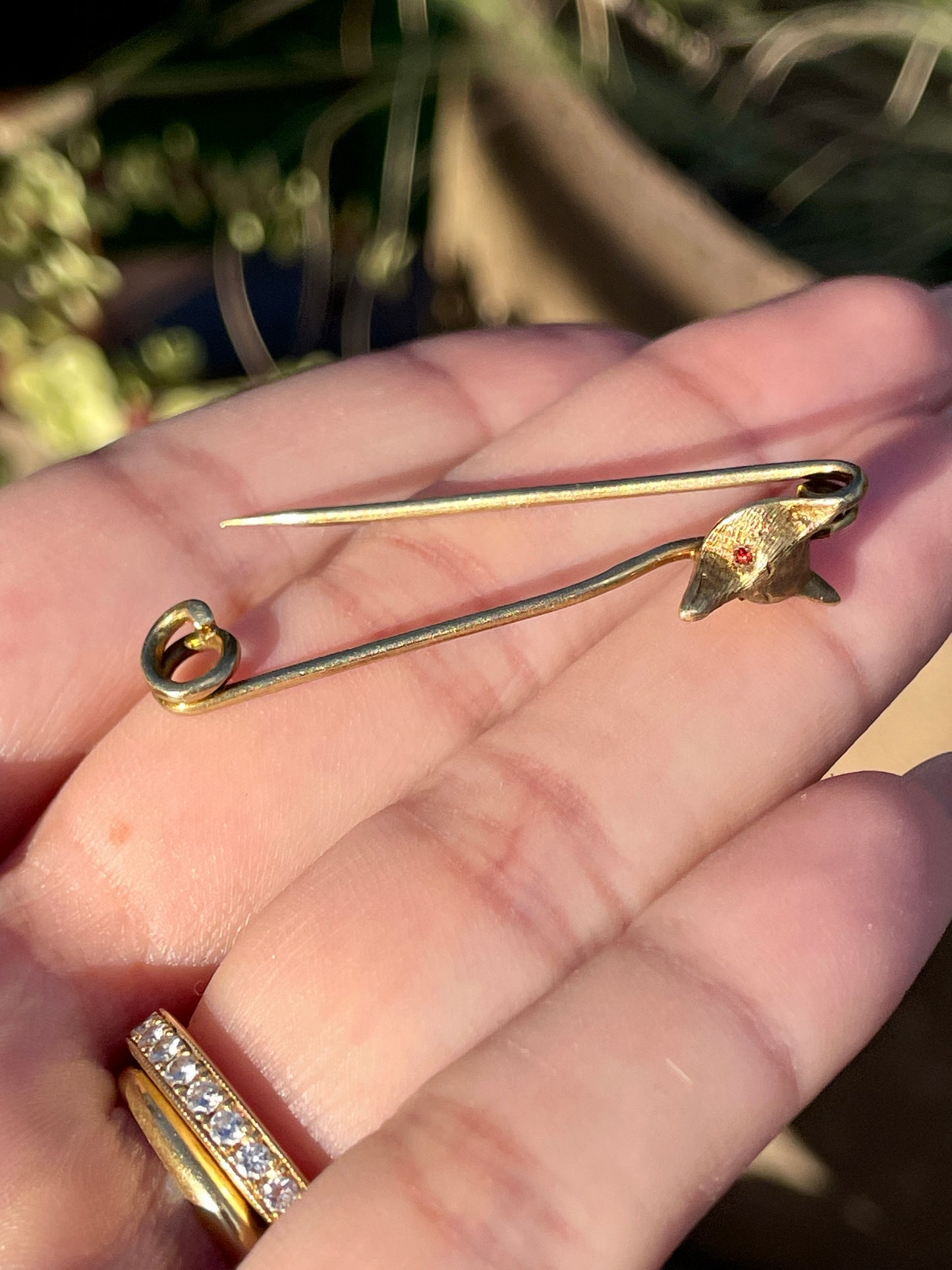 Antique yellow 14K fox safety pin with garnet eyes