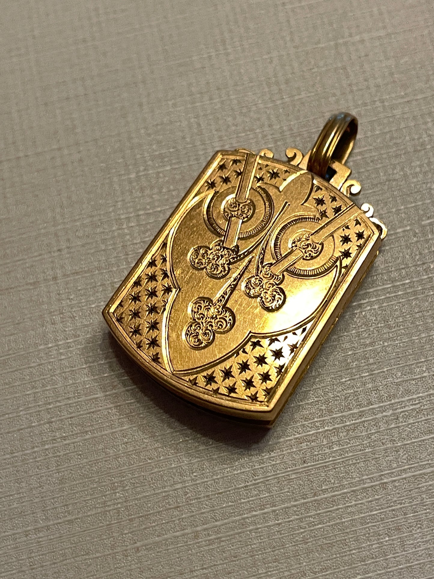 Antique warm yellow 18K engraved celestial shield locket pendant