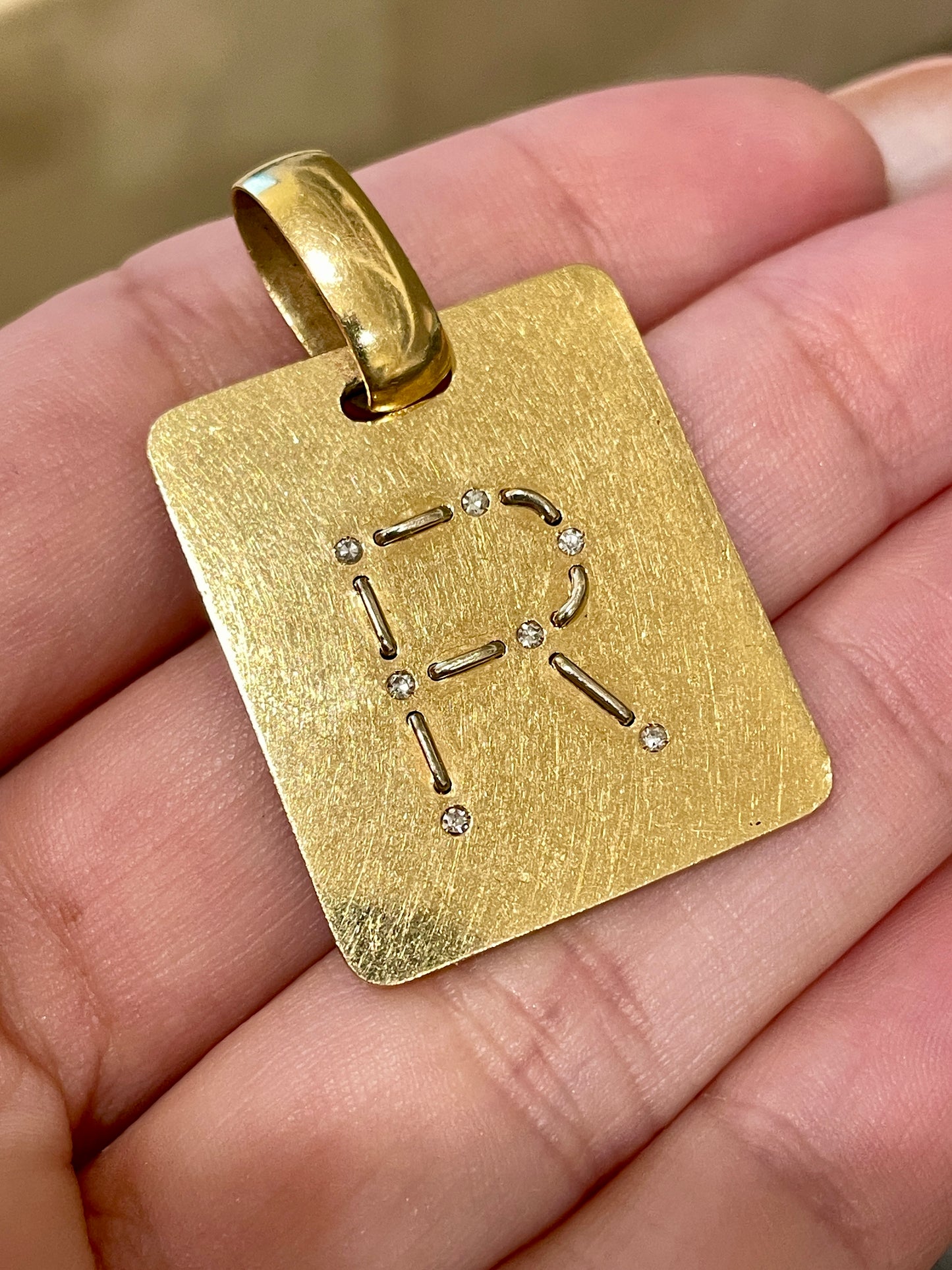 Vintage 1970s yellow 18K stitched R letter tag with diamonds by Gio Caroli