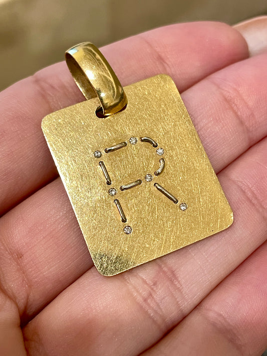 Vintage 1970s yellow 18K stitched R letter tag with diamonds by Gio Caroli