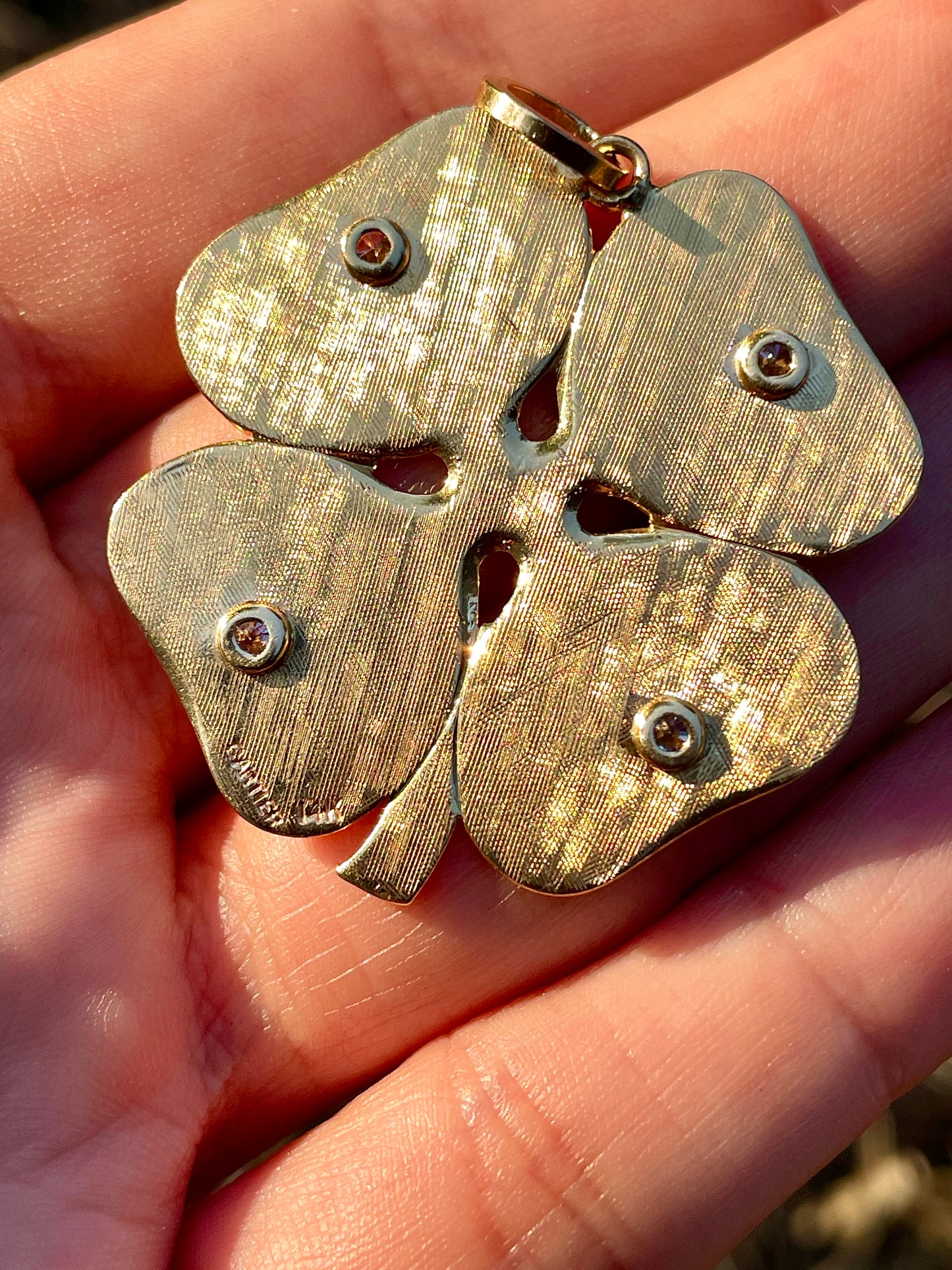 Vintage yellow 14K Cartier .25ctw star set diamond clover pendant