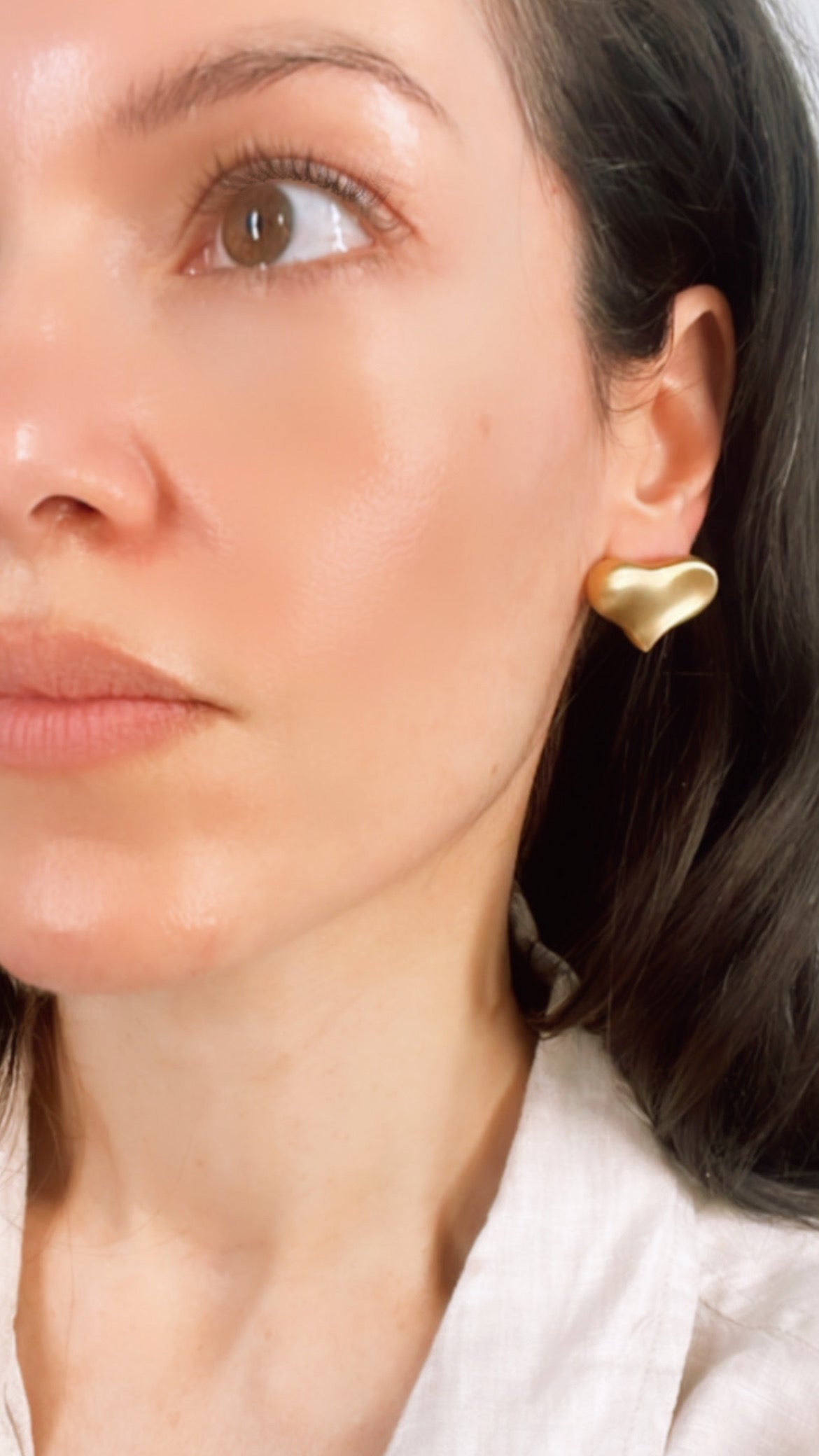 Vintage yellow 18K Angela Cummings designer satin finish heart omega back earrings from 1983