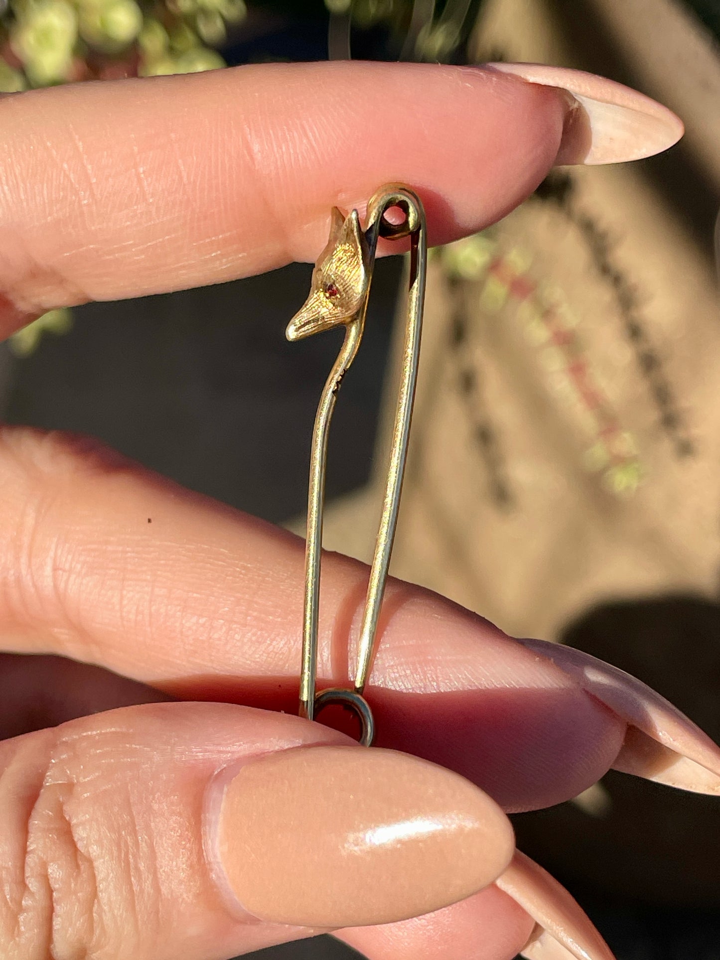 Antique yellow 14K fox safety pin with garnet eyes