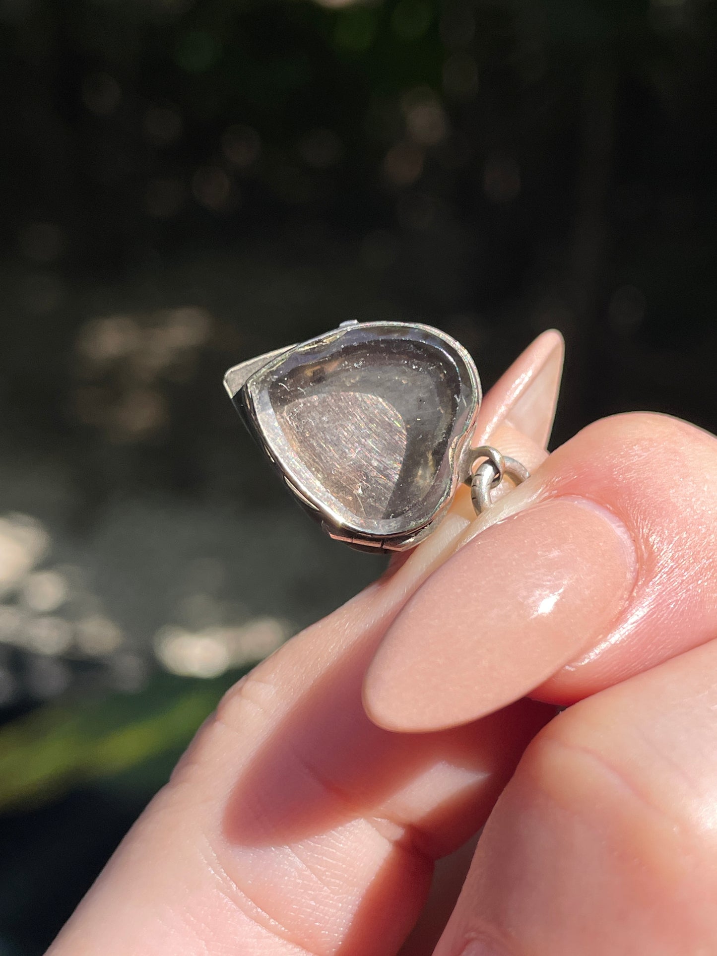 Antique sterling garnet heart celestial glass back locket charm