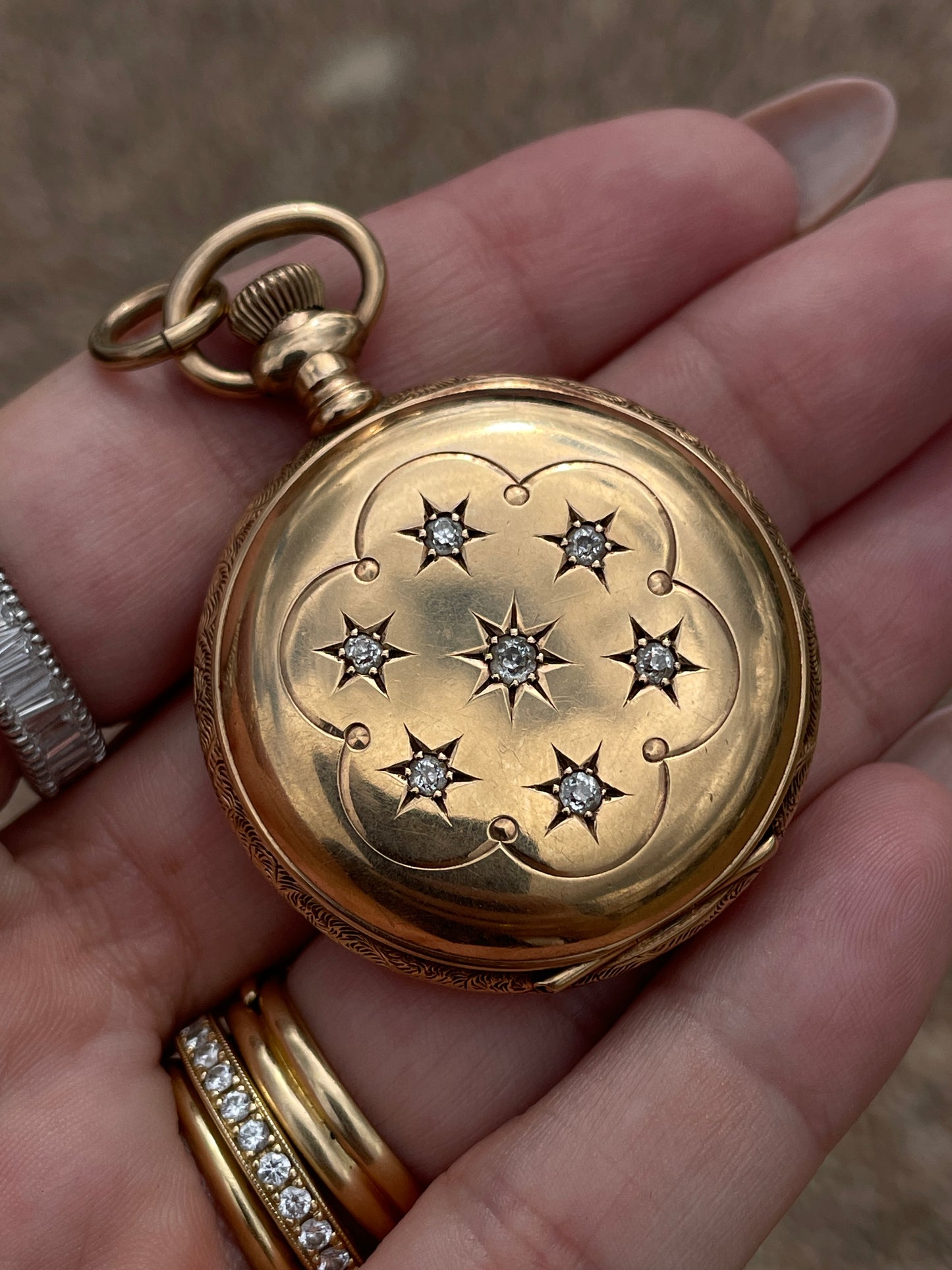 Antique yellow 14K and star set old cut diamond pocket watch with pink enamel detail