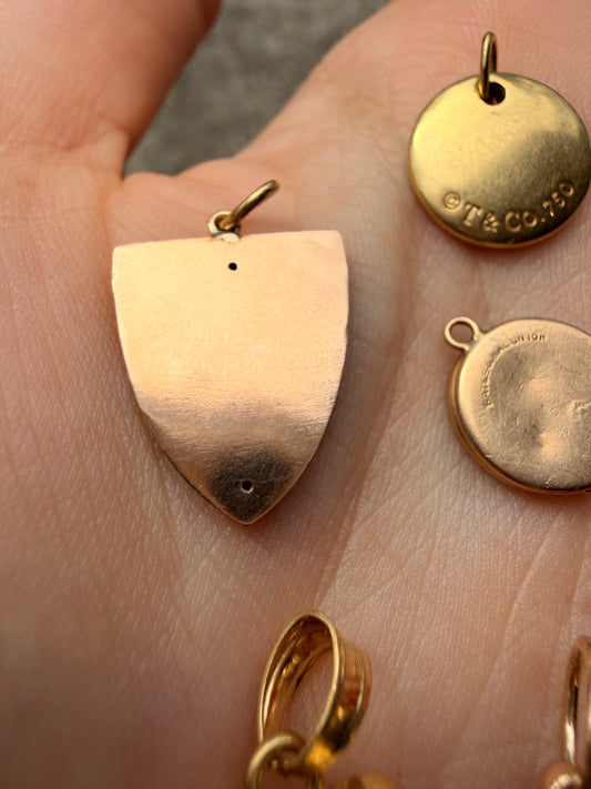 Antique yellow 14K hand engraved Dog on shield charm