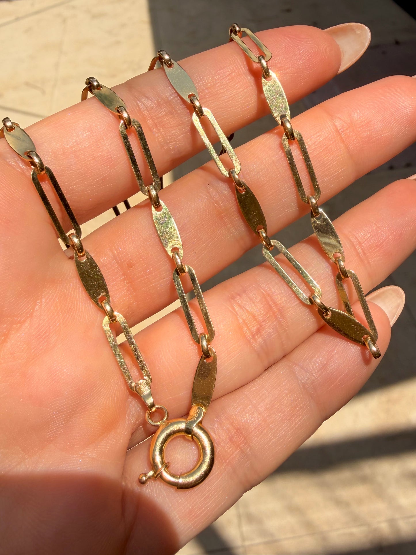 Yellow 14K gold disc and oval link chain with bolt clasp, 22 inch