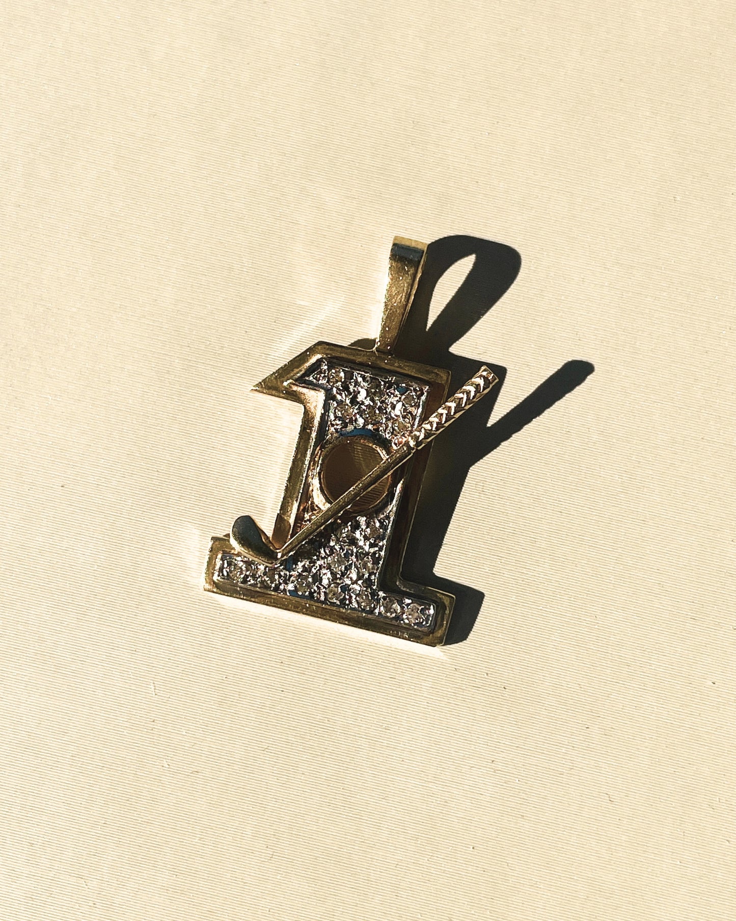 Vintage yellow and white 14K diamond hole in 1 charm