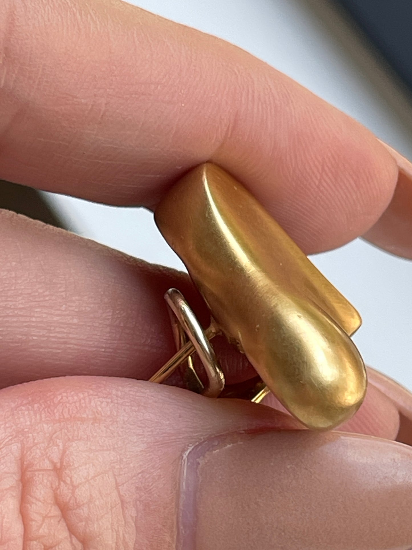 Vintage yellow 18K Angela Cummings designer satin finish heart omega back earrings from 1983