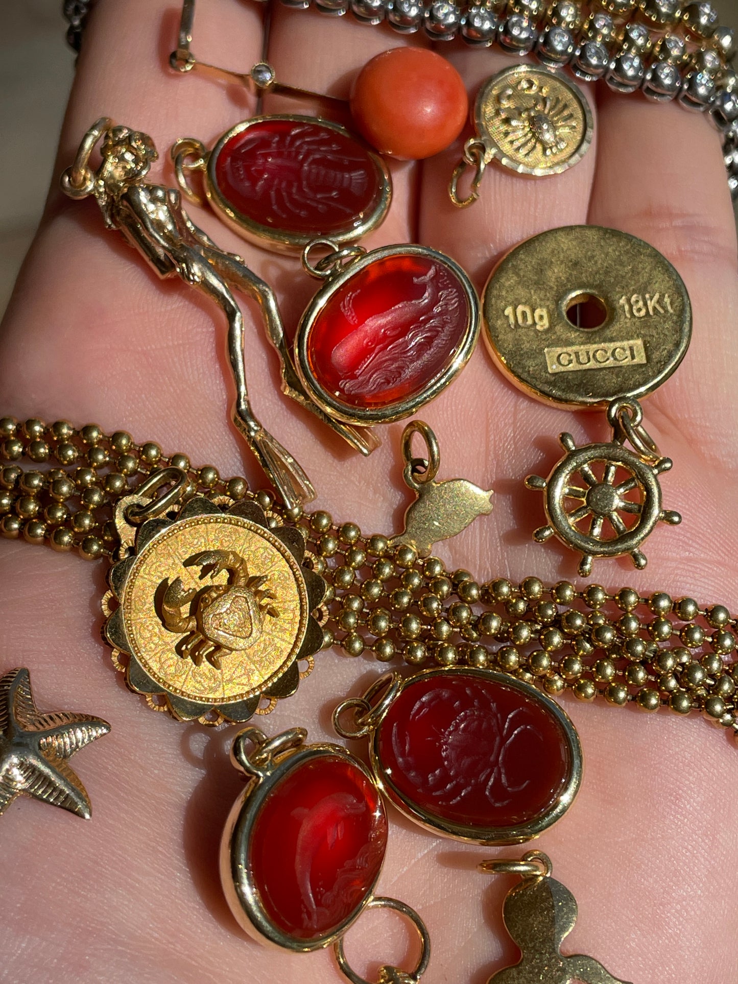 Vintage yellow 18K carved carnelian aquatic animal pebble pendants
