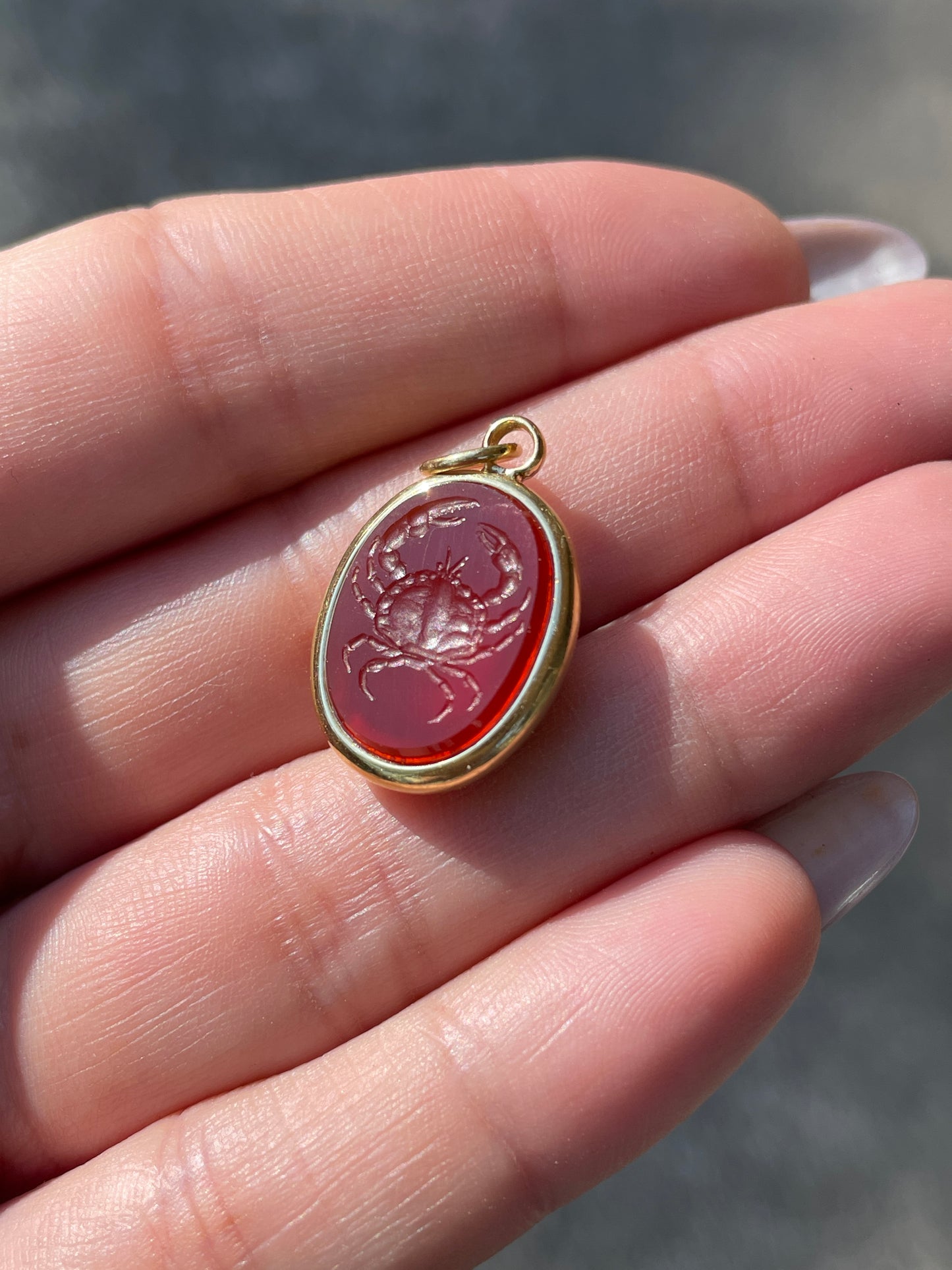 Vintage yellow 18K carved carnelian aquatic animal pebble pendants