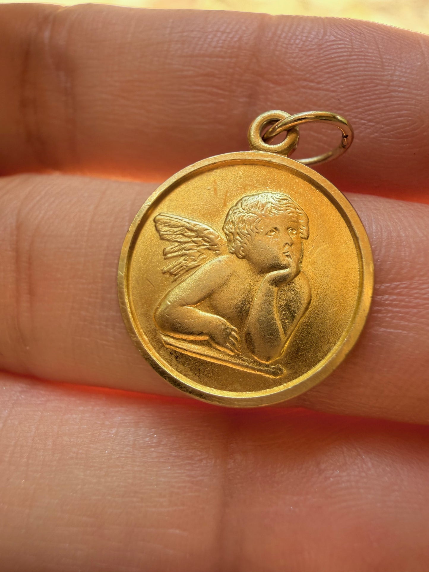 Vintage yellow 14K cherub medal charm