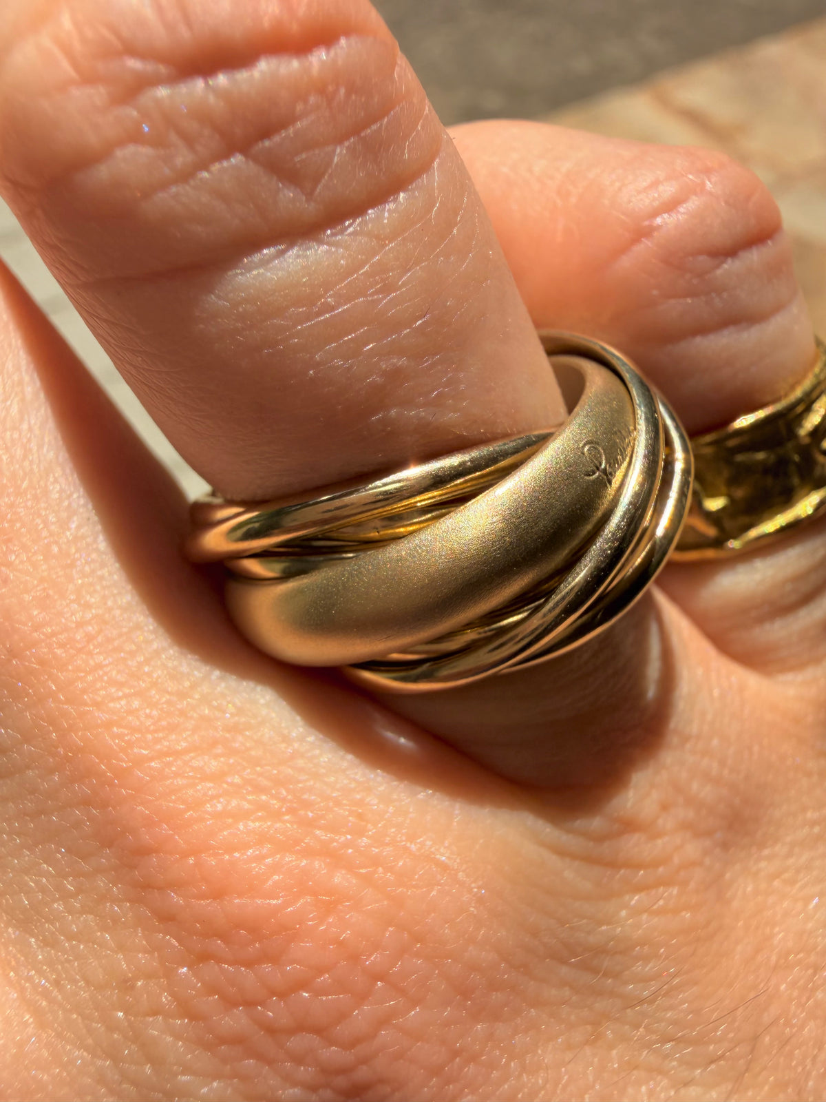 Vintage yellow 18K Pomellato designer eleven band rolling ring, size 6.25-6.5
