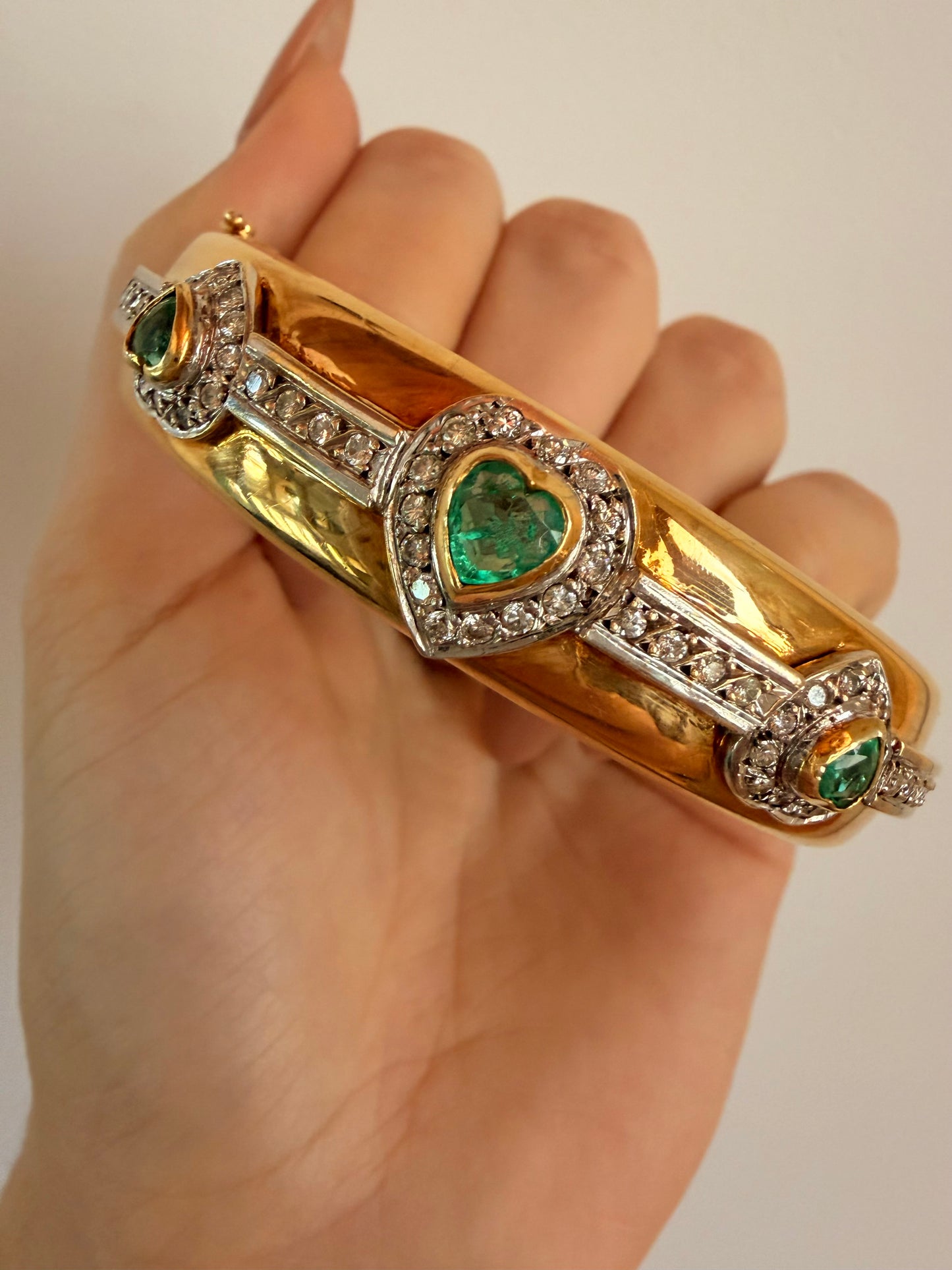 Vintage yellow 18K triple 1.73 ctw emerald and 1.14 ctw diamond heart bangle