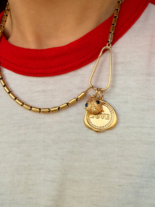 Vintage yellow 14K LOVE stamp medal pendant