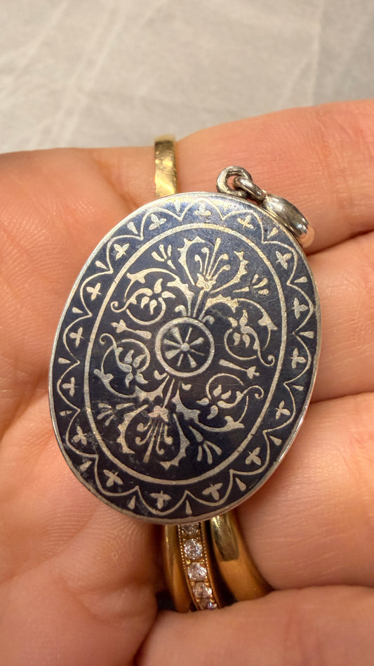 Antique silver niello and 9K gold horseshoe locket with M initial