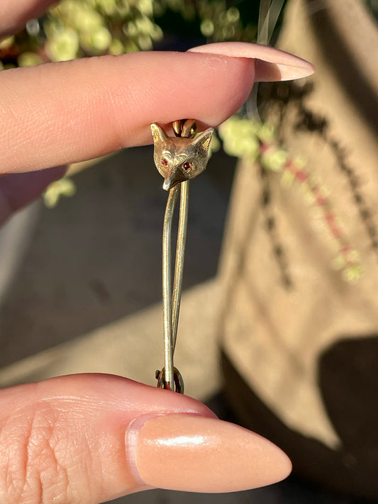 Antique yellow 14K fox safety pin with garnet eyes