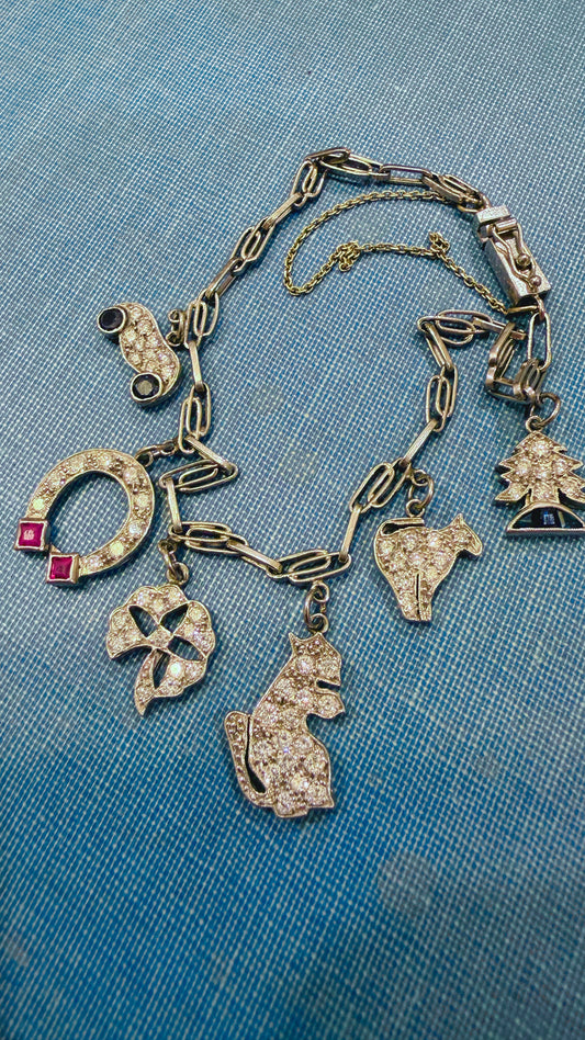 Antique platinum Art Deco charm bracelet with 1 ctw diamonds, sapphires and rubies, 7 inch