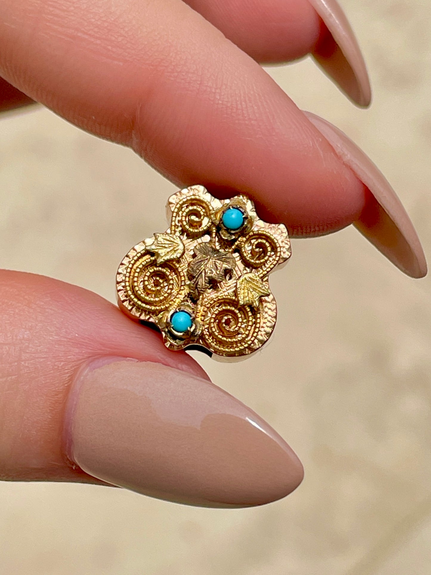 Antique yellow 14K crest shaped slider with leaves and turquoise details