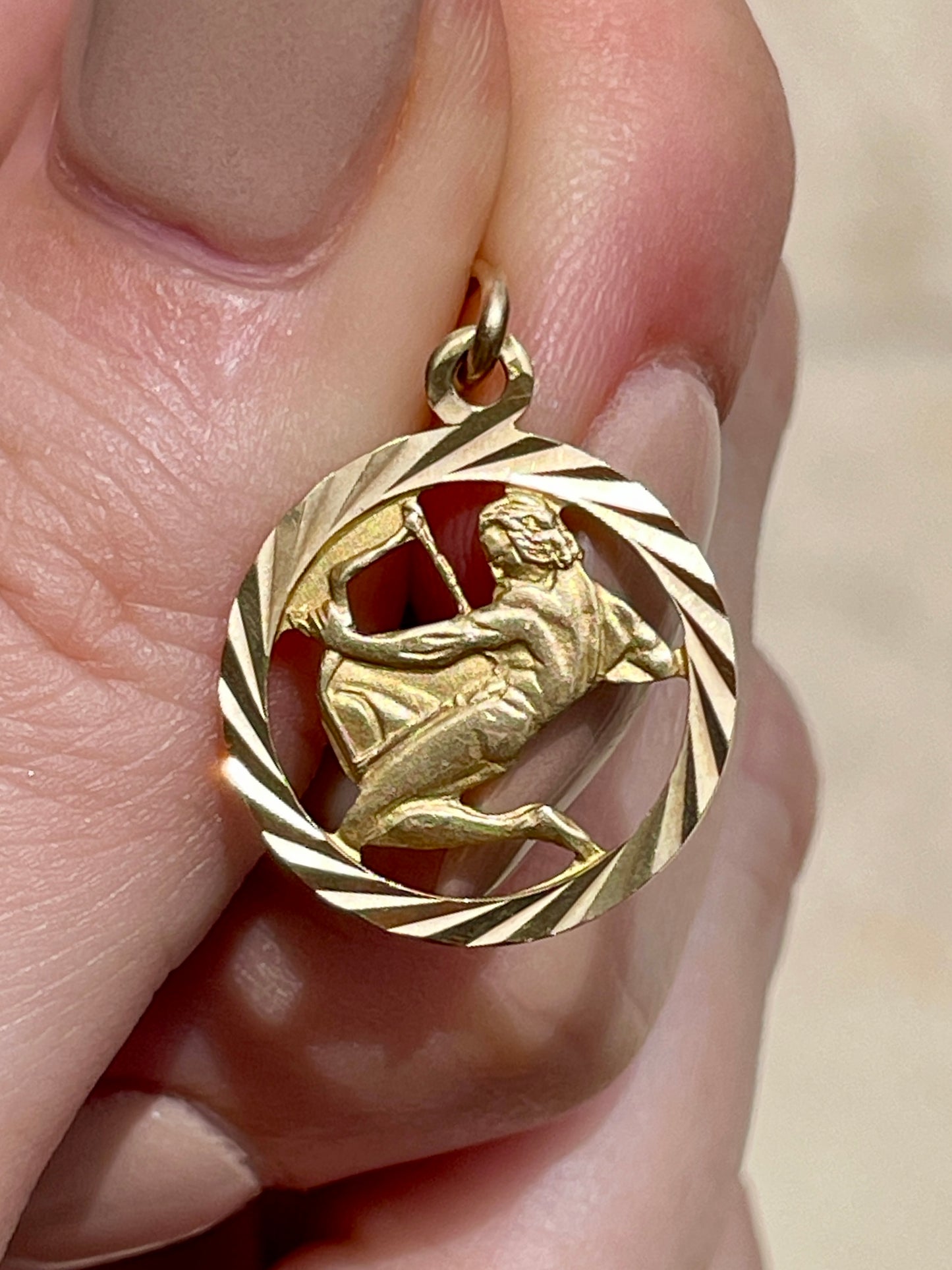Vintage yellow 14K engine turned Sagittarius open work charm