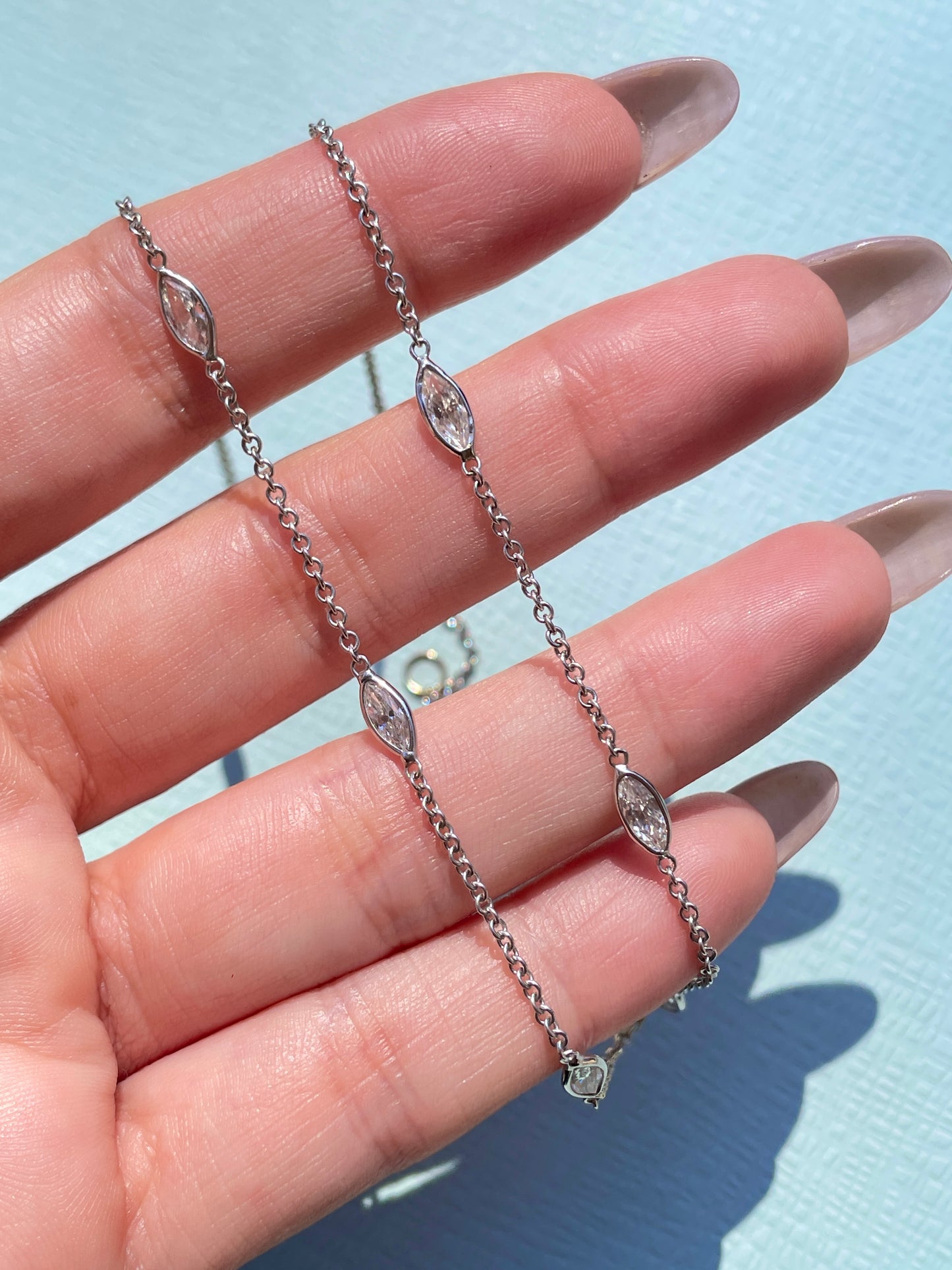 Estate white 18K gold marquise cut diamond approx 1.9 ctw station chain necklace, 17.5 inch