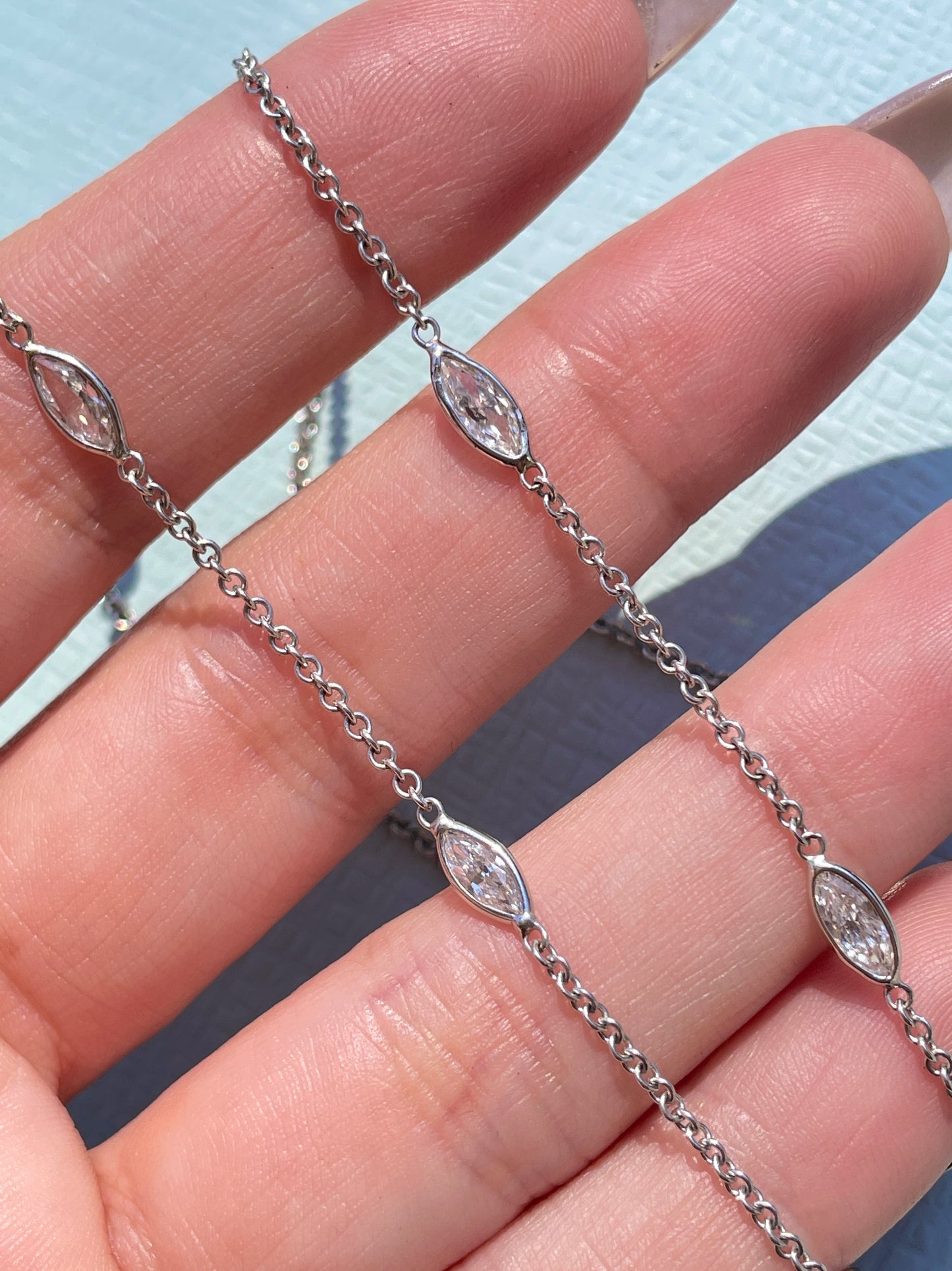 Estate white 18K gold marquise cut diamond approx 1.9 ctw station chain necklace, 17.5 inch