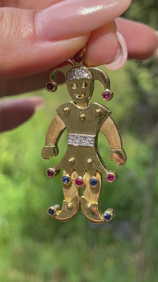 Vintage yellow 18K articulated Jester pendant with rubies, sapphires and diamonds