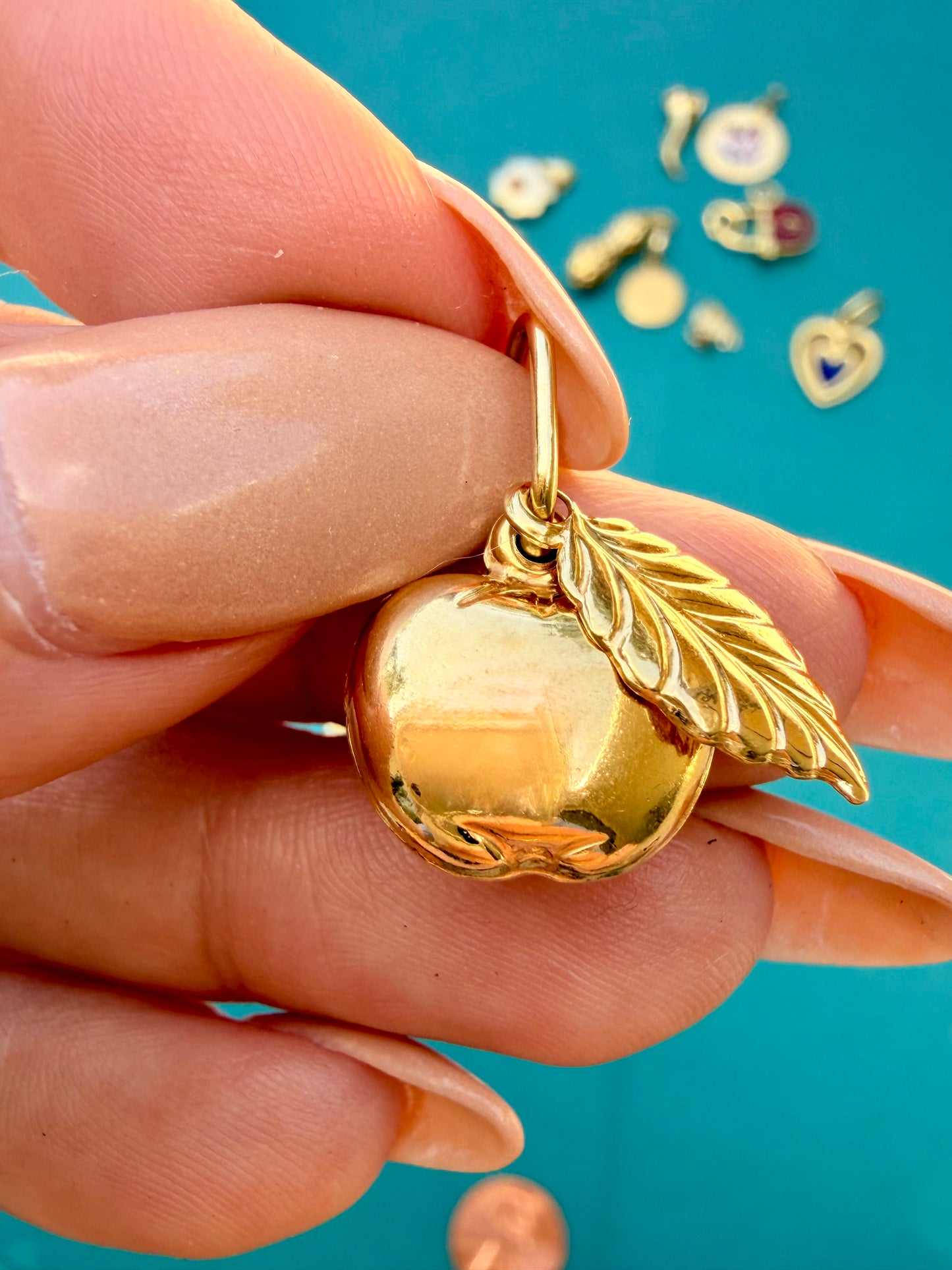 Vintage yellow 18K gold apple with movable leaf charm