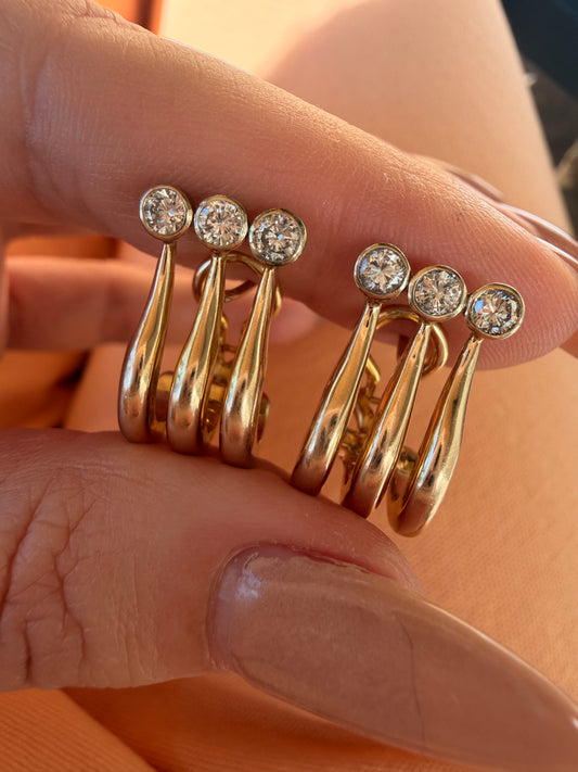 Vintage 14K and approx .84ctw bezel set diamond omega back earrings