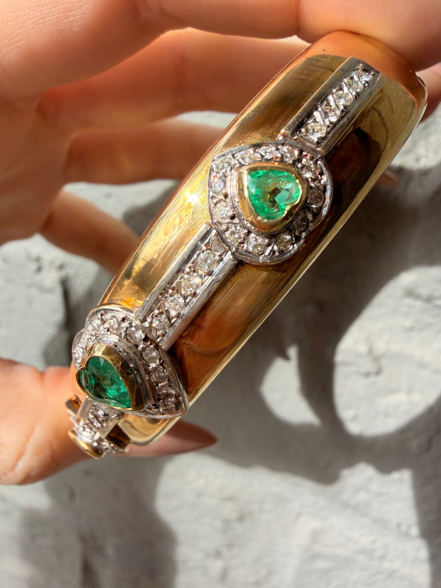 Vintage yellow 18K triple 1.73 ctw emerald and 1.14 ctw diamond heart bangle