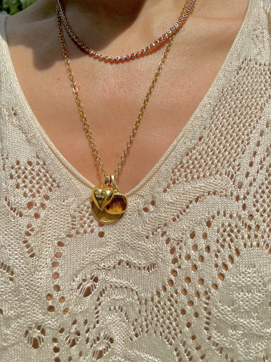 Vintage yellow 18K .08ctw diamond heart pendant