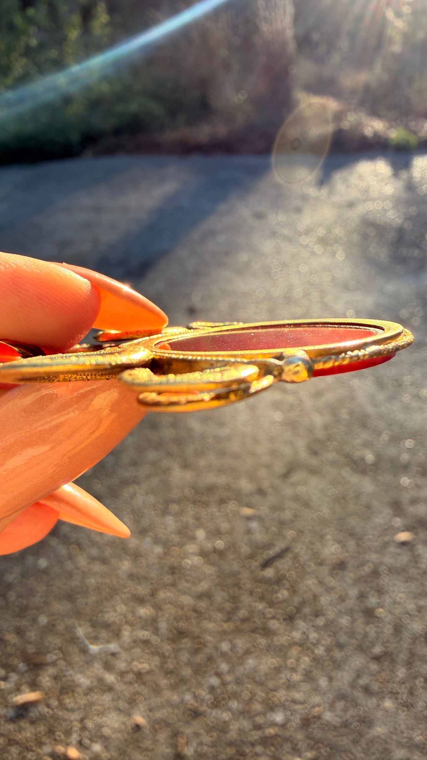 Antique yellow 18K swiveling double snake with urn carnelian pendant