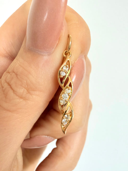 Vintage Yellow 14k approx .17ctw diamond swirl charm