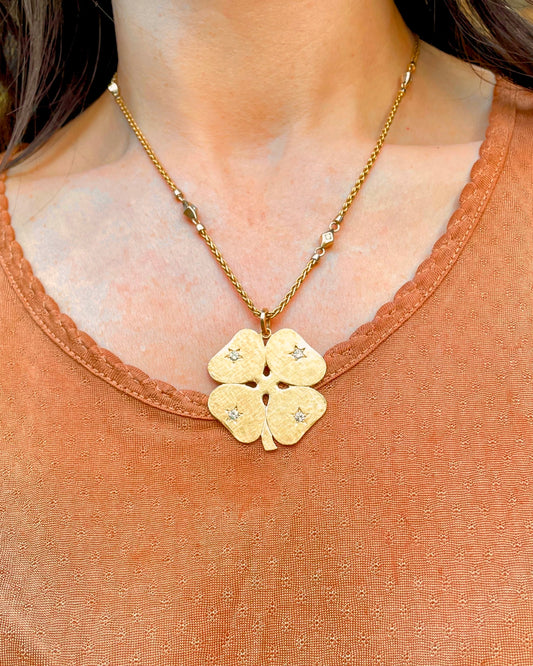 Vintage yellow 14K Cartier .25ctw star set diamond clover pendant