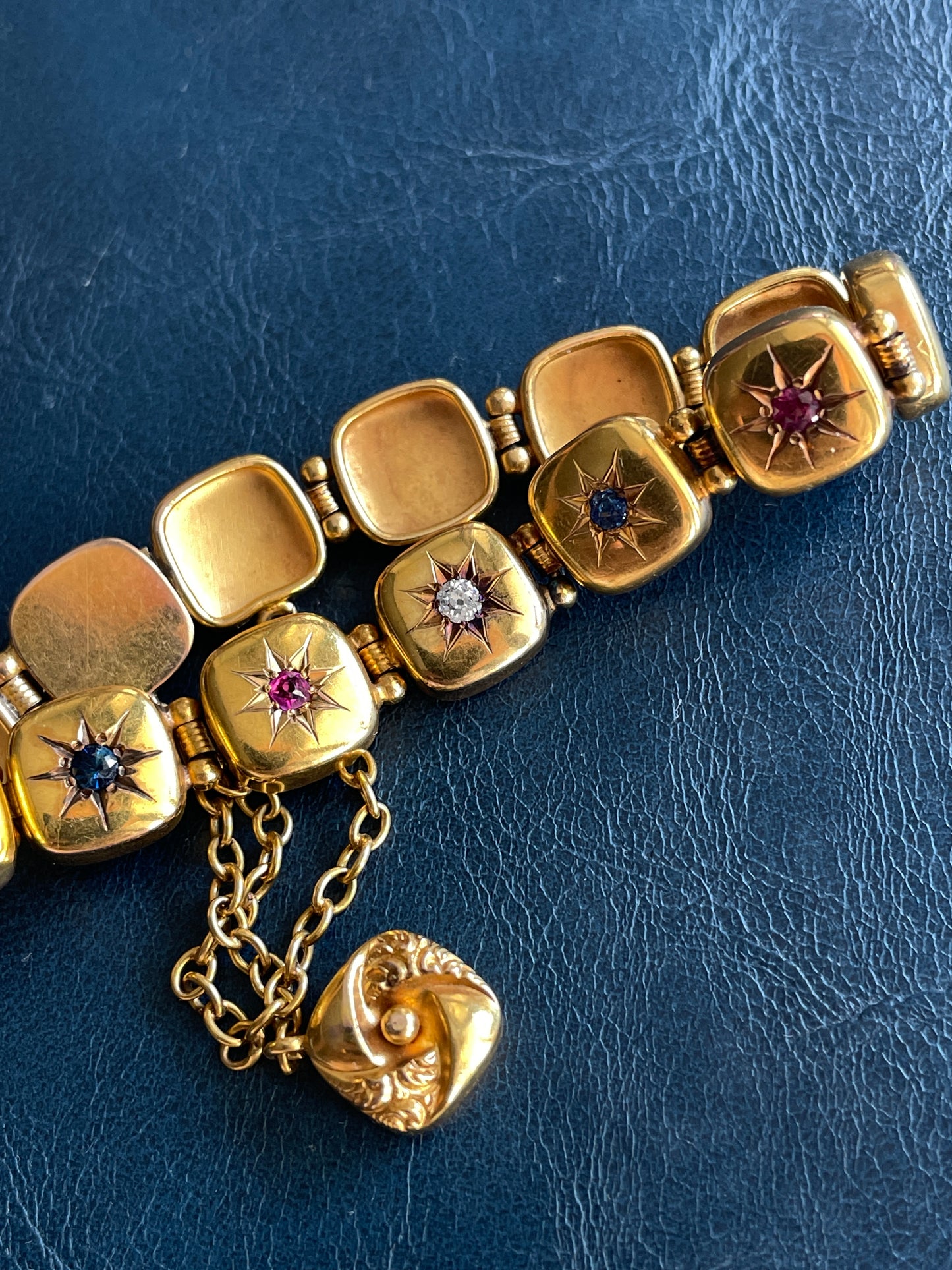 Antique yellow 14K Victorian old mine cut diamond, ruby and sapphire starburst bracelet, 6 and 5/8 inch