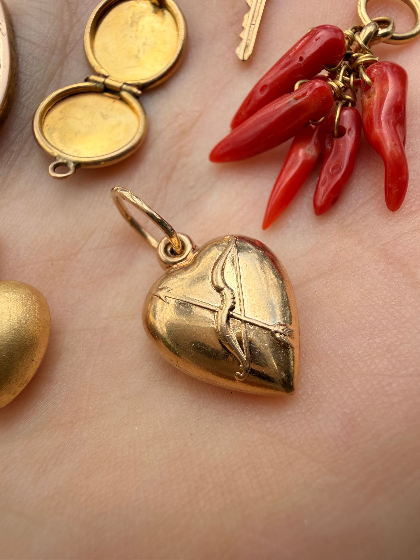 Vintage yellow 14K gold bow and arrow puffy heart charm