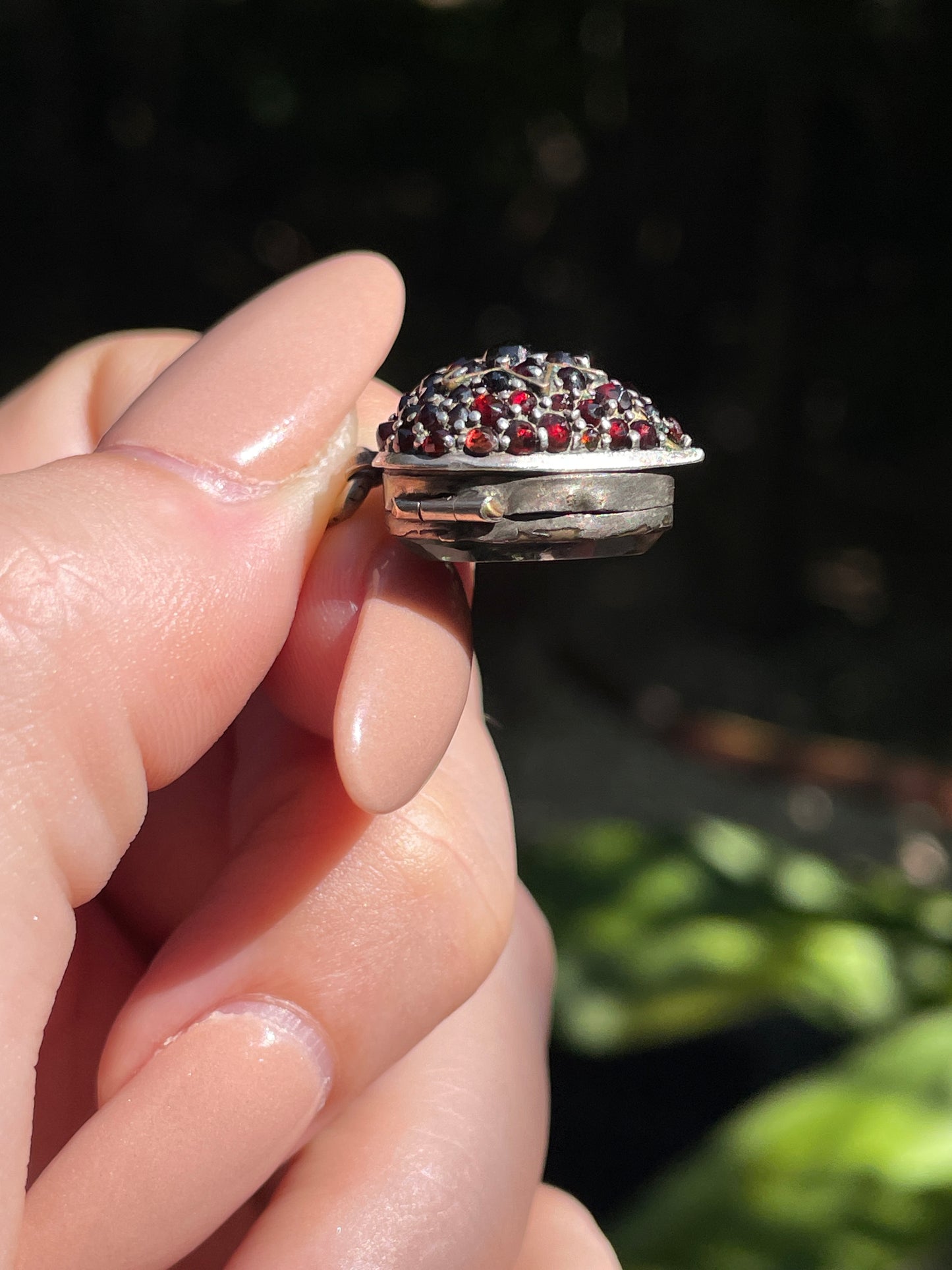 Antique sterling garnet heart celestial glass back locket charm