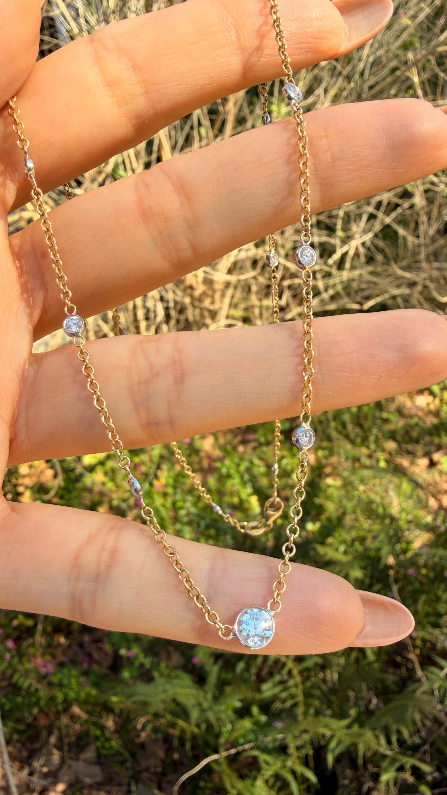 Vintage 18K approx 1.2ctw Old European Cut diamond and round diamond station chain, 18 3/8 inch