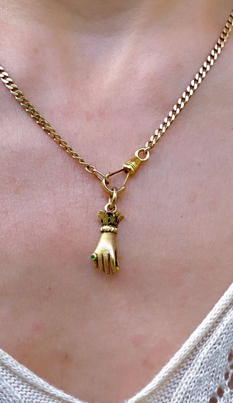 Antique yellow 18K hand charm wearing emerald ring