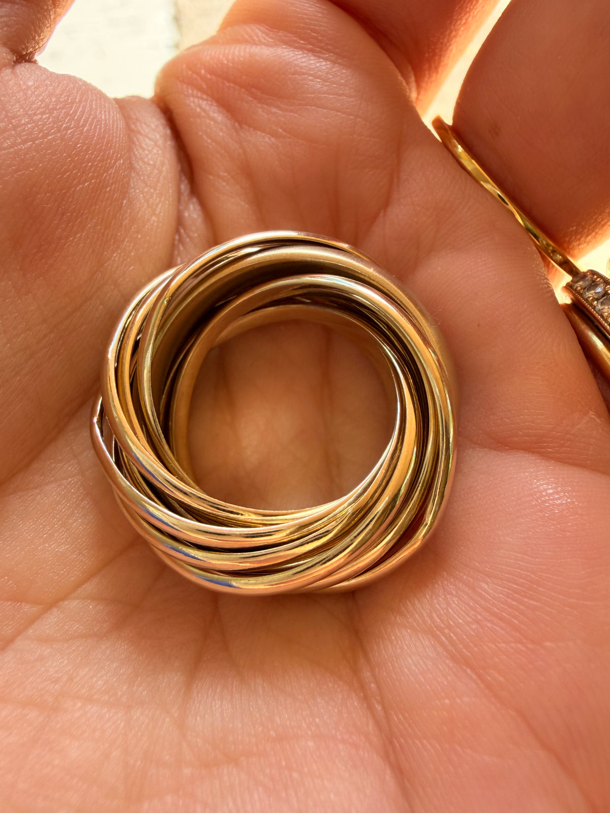 Vintage yellow 18K Pomellato designer eleven band rolling ring, size 6.25-6.5