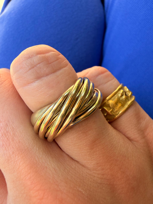 Vintage yellow 18K Pomellato designer eleven band rolling ring, size 6.25-6.5