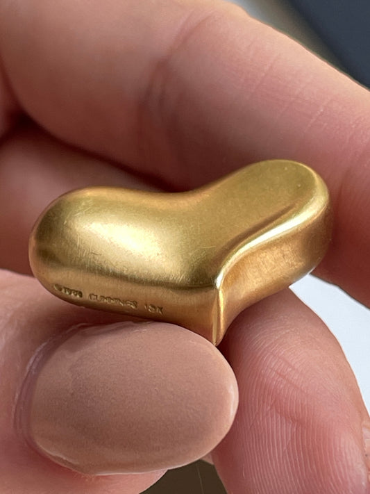 Vintage yellow 18K Angela Cummings designer satin finish heart omega back earrings from 1983
