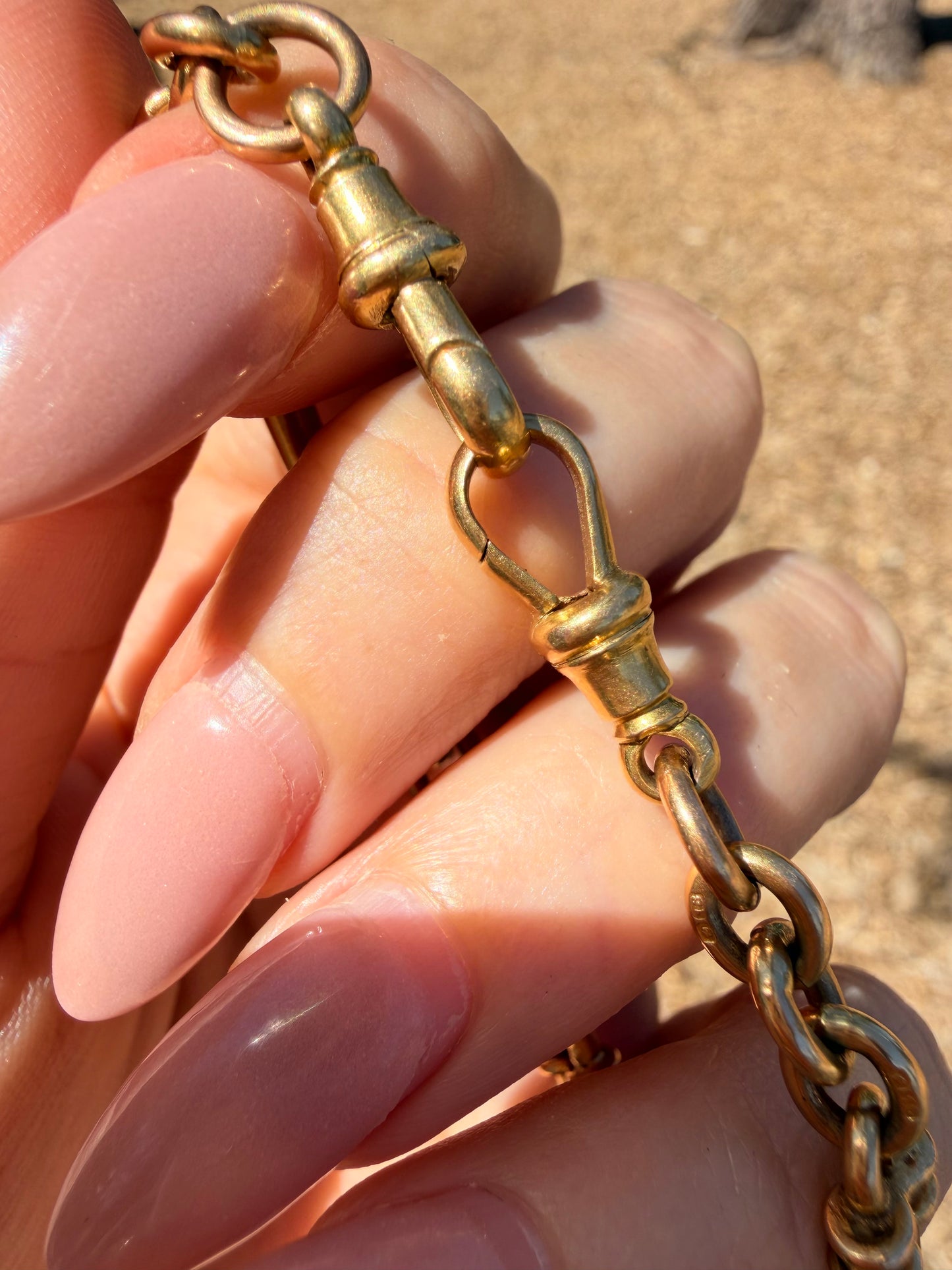 Antique yellow 18K fancy trombone watch chain with double dog clips, 19 and 1/8 inch long with extra link for extension