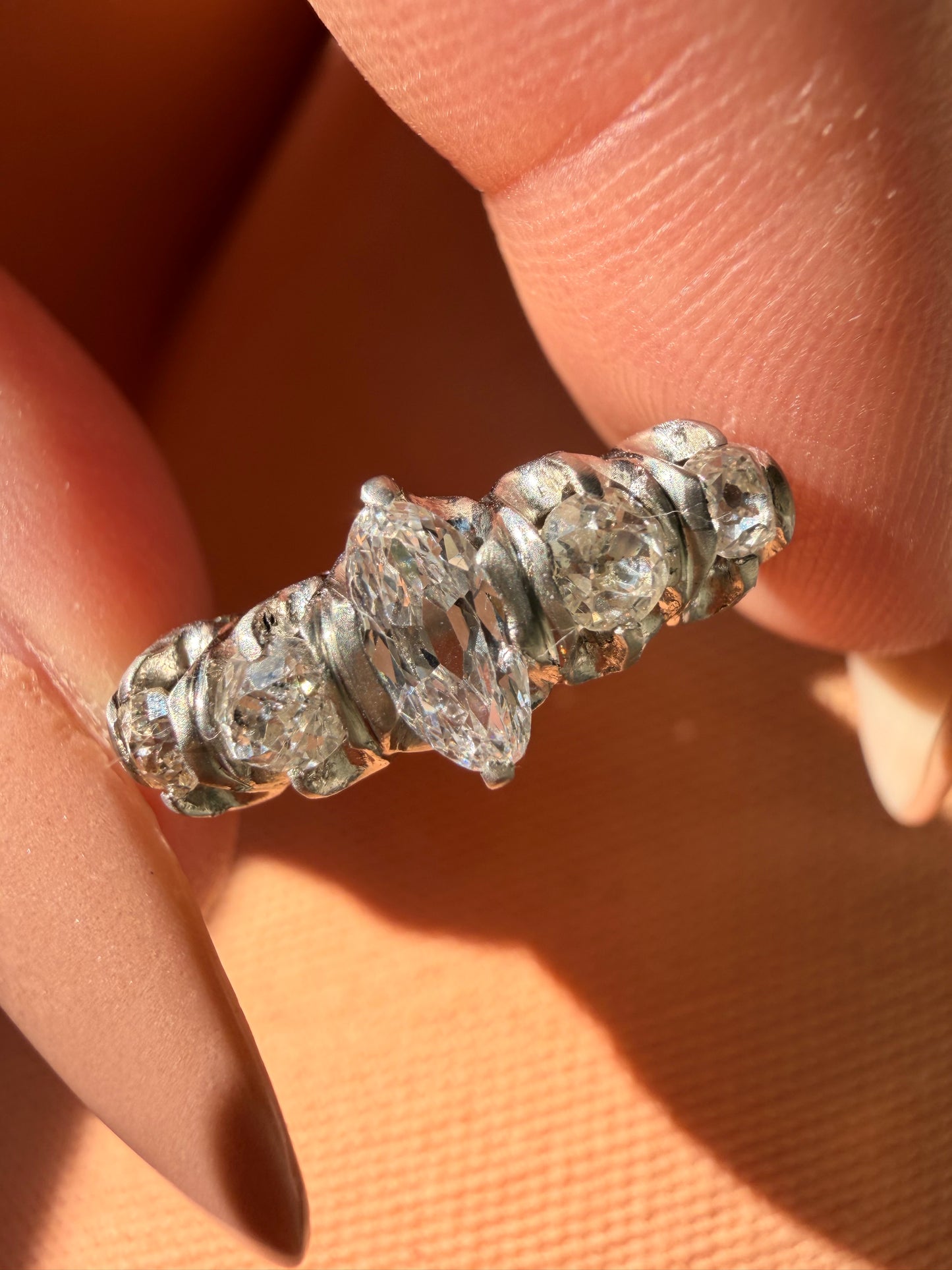 Antique platinum approx 1.1ctw moval diamond and old mine cut diamond 5 stone ring, size 5.5-5.75